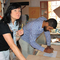 In Mohamed's studio in Marrakech, working on the Title Piece.2010. The Street Gallery, Institute of Arab & Islamic Studies, University of Exeter.