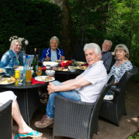 The artists and others having a relaxing lunch in the garden after the vernissage.